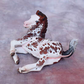 Painted model horse sculpture created by artist Angelica Anzelmo